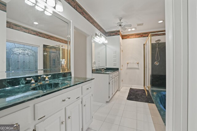 885 Kelleytown Rd, Mcdonough, GA 30252 - bathroom featuring tile patterned flooring, a stall shower, ceiling fan, ornamental molding, and two vanities