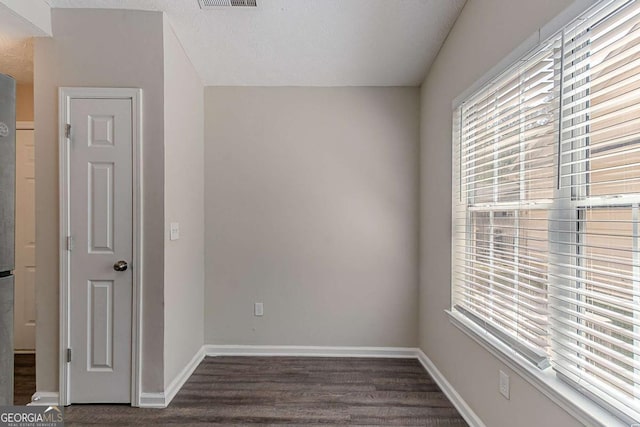 1363 To Lani Farm Rd, Stone Mountain, GA 30083 - unfurnished room with dark wood-style flooring and baseboards