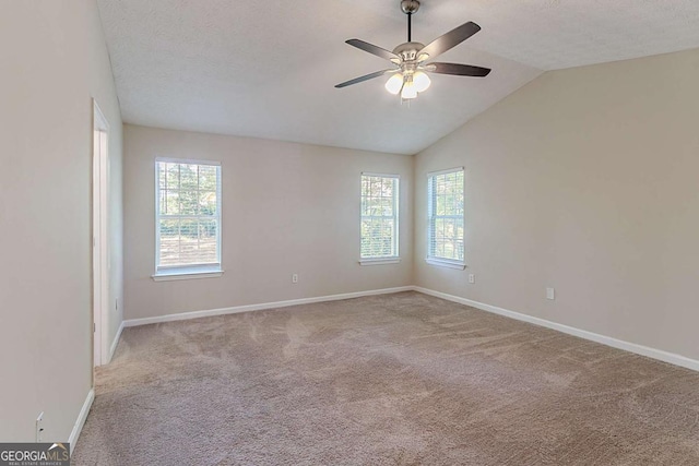 1363 To Lani Farm Rd, Stone Mountain, GA 30083 - carpeted empty room with a ceiling fan, baseboards, vaulted ceiling, and a textured ceiling