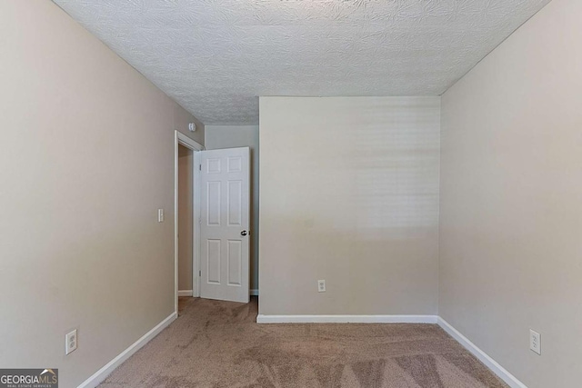 1363 To Lani Farm Rd, Stone Mountain, GA 30083 - carpeted spare room featuring baseboards and a textured ceiling