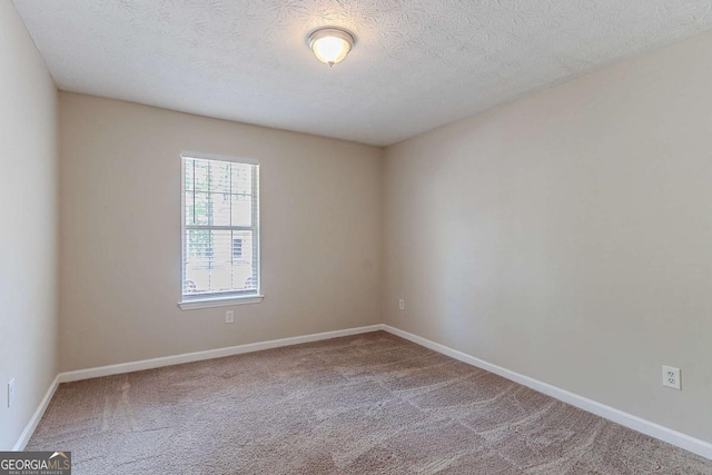 1363 To Lani Farm Rd, Stone Mountain, GA 30083 - carpeted empty room with baseboards and a textured ceiling