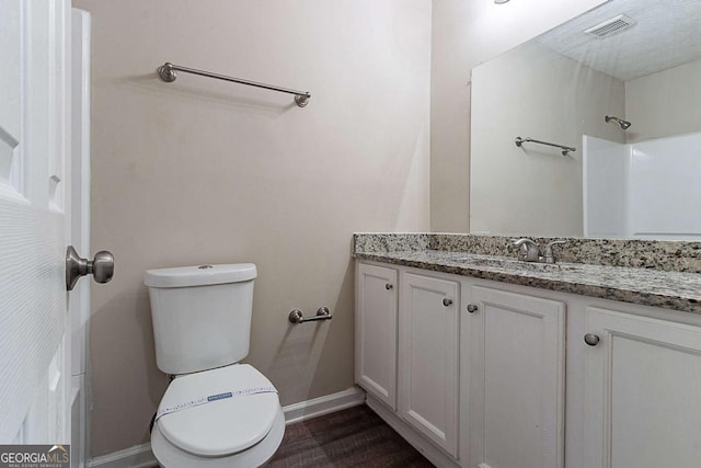 1363 To Lani Farm Rd, Stone Mountain, GA 30083 - bathroom with toilet, vanity, baseboards, and wood finished floors