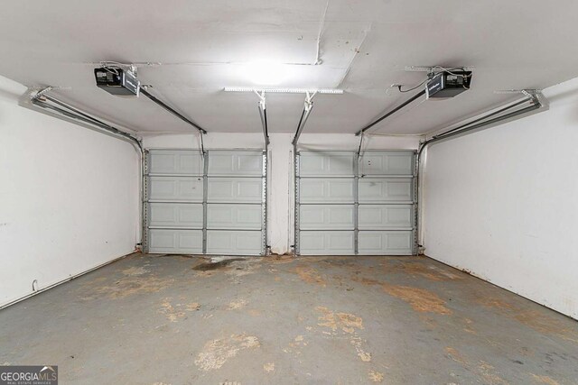 1363 To Lani Farm Rd, Stone Mountain, GA 30083 - garage featuring a garage door opener
