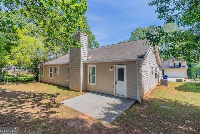 1363 To Lani Farm Rd, Stone Mountain, GA 30083 - back of house featuring a chimney, a patio, cooling unit, a yard, and a shingled roof