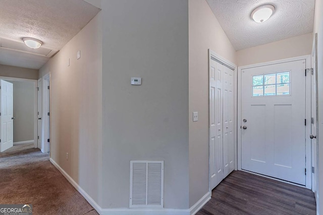 1363 To Lani Farm Rd, Stone Mountain, GA 30083 - foyer entrance featuring a textured ceiling and baseboards
