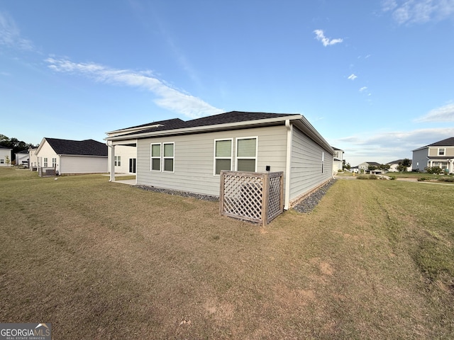 2051 Blue Sky Ave, Covington, GA 30016 - rear view of house with a lawn