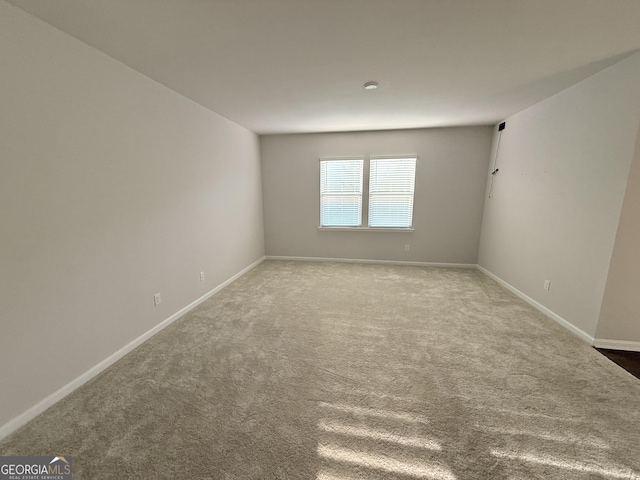 2051 Blue Sky Ave, Covington, GA 30016 - empty room with carpet flooring and baseboards