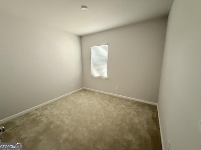 2051 Blue Sky Ave, Covington, GA 30016 - spare room featuring carpet flooring and baseboards
