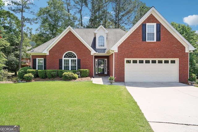1010 Capella Creek Way, Grayson, GA 30017 - traditional-style home featuring concrete driveway, a front lawn, and brick siding