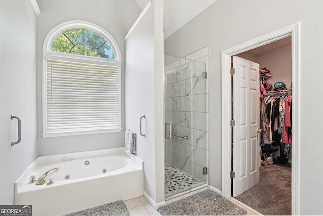 1010 Capella Creek Way, Grayson, GA 30017 - bathroom with a shower stall, a walk in closet, a jetted tub, and tile patterned flooring