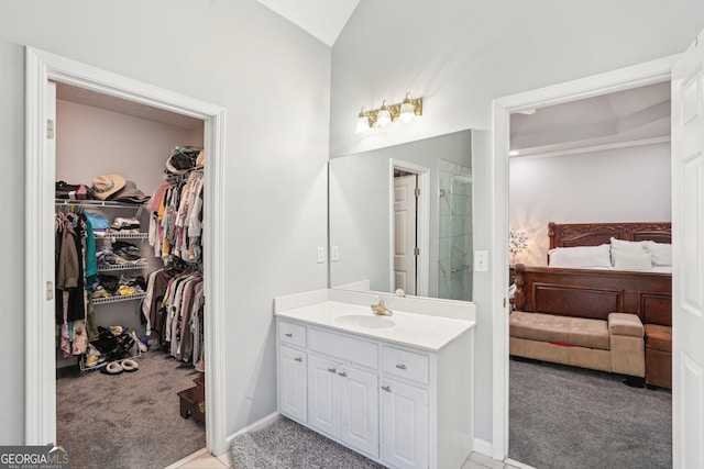 1010 Capella Creek Way, Grayson, GA 30017 - full bathroom with ensuite bathroom, vanity, a spacious closet, vaulted ceiling, and a shower with shower door