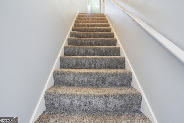 1010 Capella Creek Way, Grayson, GA 30017 - staircase with carpet flooring and baseboards