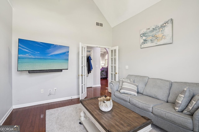 1010 Capella Creek Way, Grayson, GA 30017 - living room with french doors, baseboards, wood finished floors, and high vaulted ceiling
