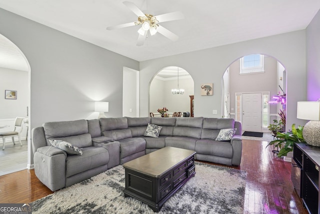 1010 Capella Creek Way, Grayson, GA 30017 - living area with arched walkways, hardwood / wood-style flooring, a ceiling fan, and a chandelier