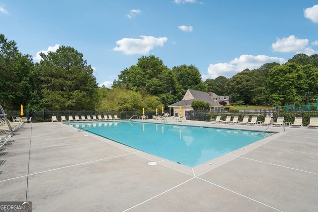 1010 Capella Creek Way, Grayson, GA 30017 - community pool with fence and a patio