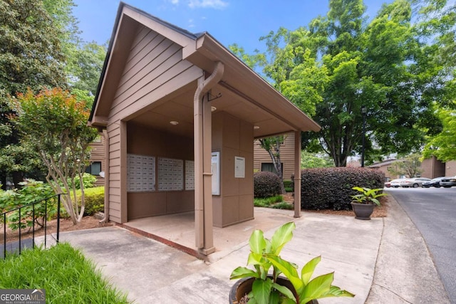 view of patio featuring mail area
