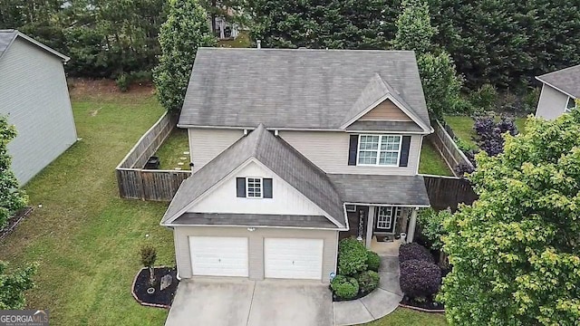 view of front of home featuring concrete driveway and roof with shingles