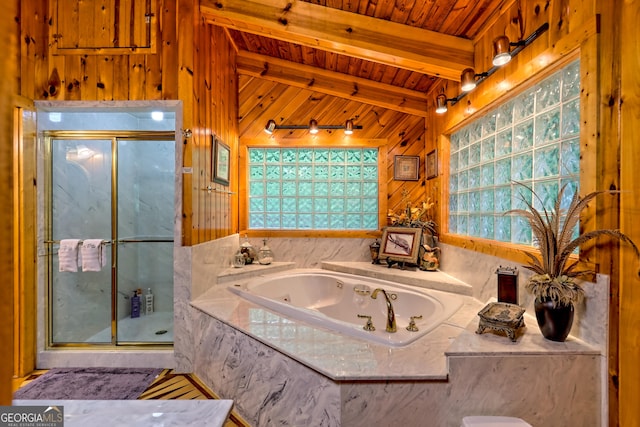 bathroom with a shower stall, wooden ceiling, a tub with jets, and wood walls