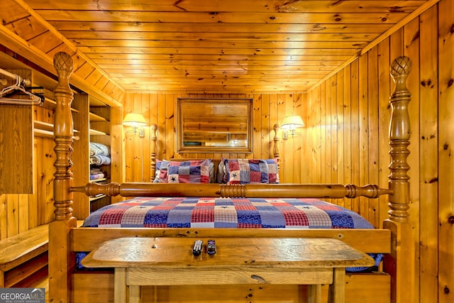 bedroom with wooden ceiling and wood walls