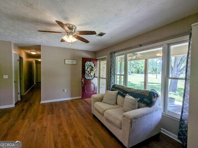 2003 Brenda Ln, Vidalia, GA 30474 - living room with baseboards, ceiling fan, wood finished floors, and a textured ceiling