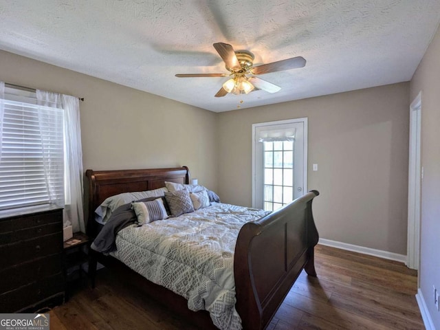 2003 Brenda Ln, Vidalia, GA 30474 - bedroom featuring wood finished floors, baseboards, a ceiling fan, and a textured ceiling