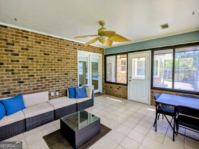 2003 Brenda Ln, Vidalia, GA 30474 - sunroom / solarium with outdoor lounge area and a ceiling fan