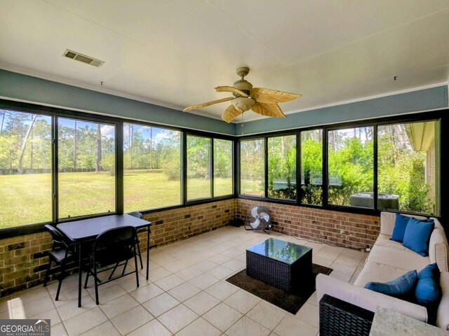 2003 Brenda Ln, Vidalia, GA 30474 - sunroom featuring outdoor lounge area and ceiling fan