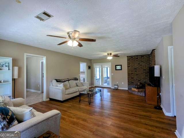 2003 Brenda Ln, Vidalia, GA 30474 - living area featuring ceiling fan, a textured ceiling, wood finished floors, and baseboards