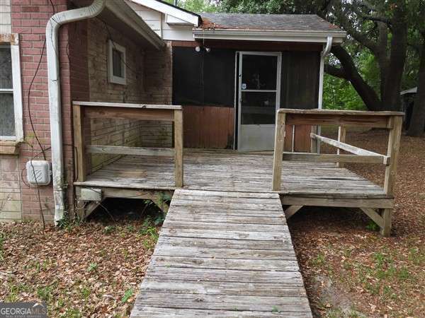 410 Live Oak Church Rd, Hinesville, GA 31313 - wooden terrace with a sunroom