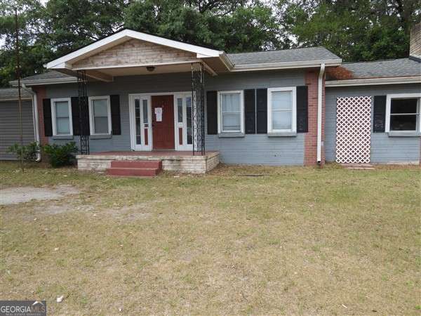 410 Live Oak Church Rd, Hinesville, GA 31313 - single story home with a front lawn and a porch