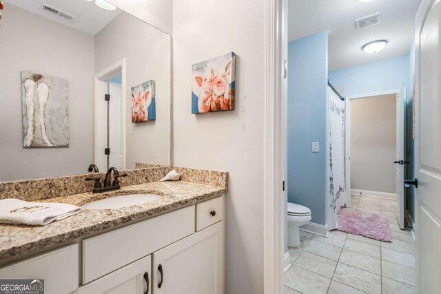 full bath with toilet, vanity, tile patterned flooring, and a shower with curtain