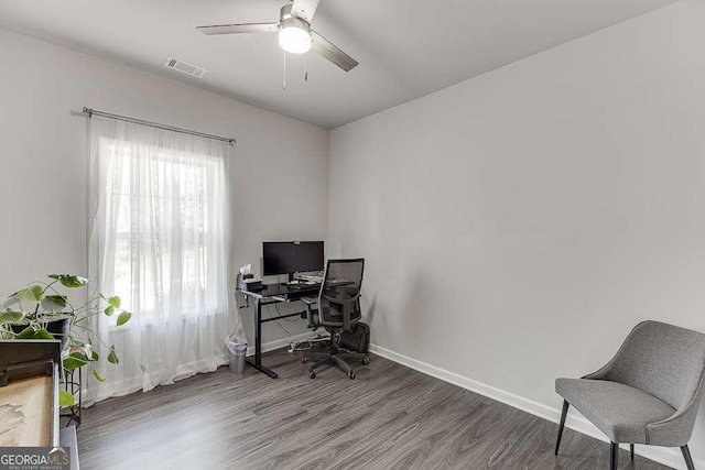 office area with wood finished floors, a ceiling fan, and baseboards