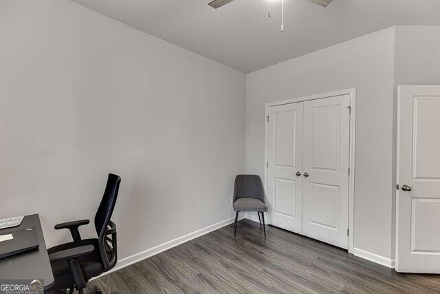 office featuring wood finished floors, ceiling fan, and baseboards