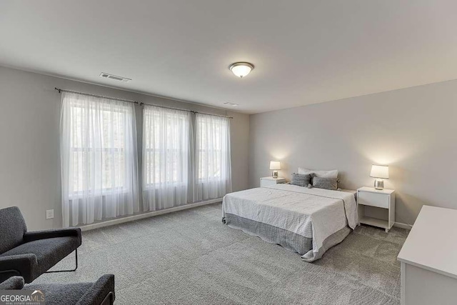 bedroom with light colored carpet