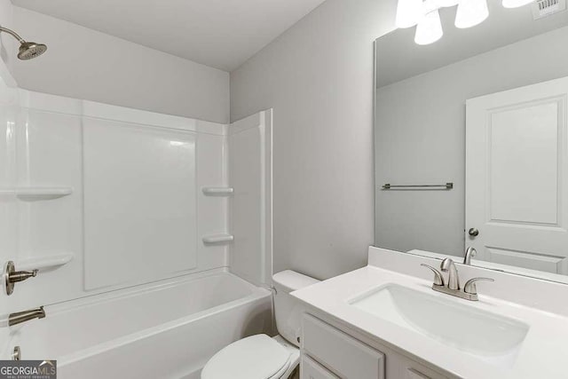 full bath with toilet, vanity, and washtub / shower combination