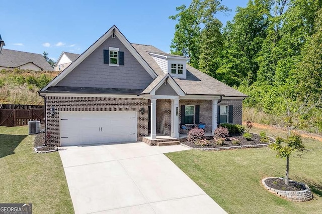 craftsman house with brick siding, a porch, driveway, and central AC