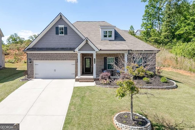 craftsman-style home featuring a front lawn, brick siding, and driveway