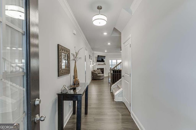 hallway with crown molding, stairway, dark wood finished floors, baseboards, and recessed lighting