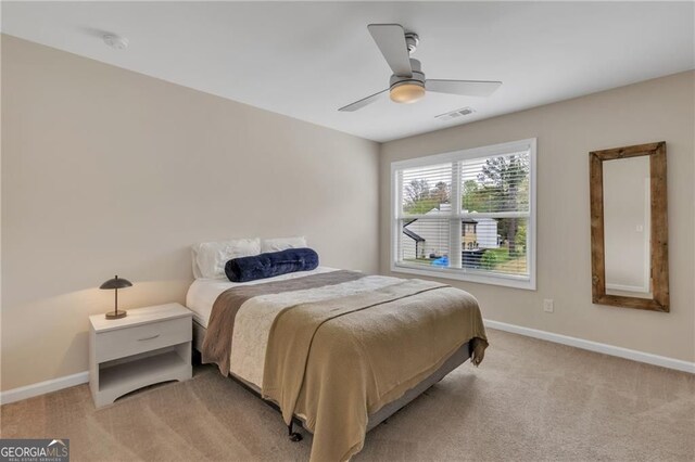 4567 Hickory Forest Dr, Acworth, GA 30102 - bedroom featuring light carpet, baseboards, and a ceiling fan