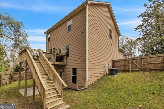 4567 Hickory Forest Dr, Acworth, GA 30102 - rear view of property featuring stairway, a deck, central AC unit, and a gate