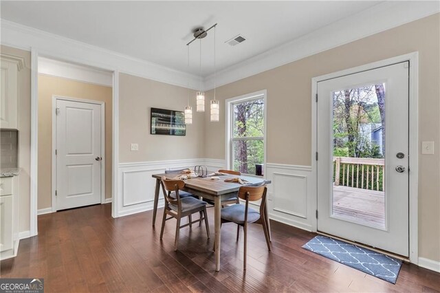 4567 Hickory Forest Dr, Acworth, GA 30102 - dining space featuring dark wood-type flooring, wainscoting, and crown molding