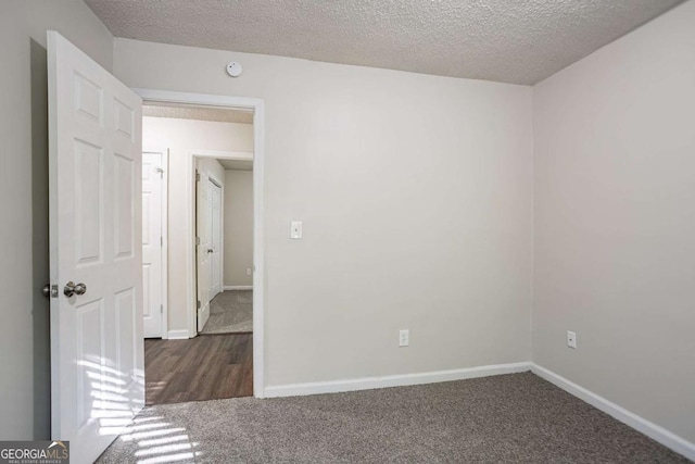 2800 Macon Dr SE, Atlanta, GA 30354 - carpeted empty room with baseboards, a textured ceiling, and a smoke detector