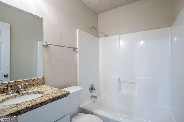 2800 Macon Dr SE, Atlanta, GA 30354 - full bathroom with a textured ceiling, toilet, vanity, and bathtub / shower combination