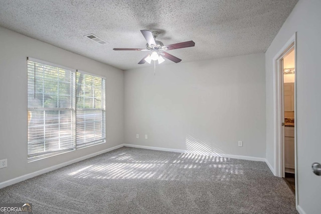 2800 Macon Dr SE, Atlanta, GA 30354 - unfurnished room with ceiling fan, carpet flooring, baseboards, and a textured ceiling