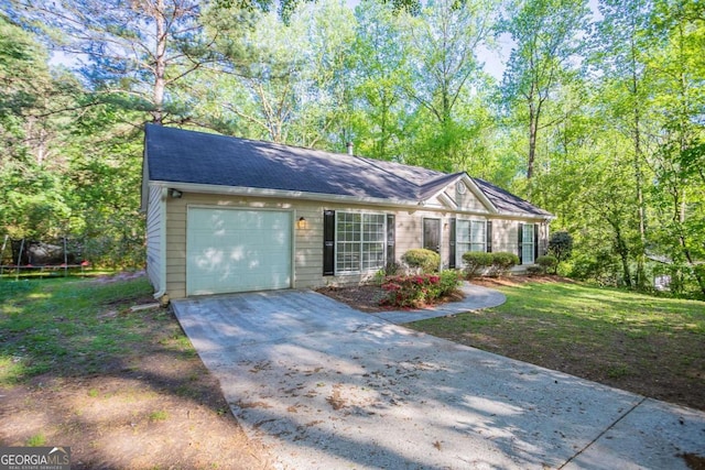 2800 Macon Dr SE, Atlanta, GA 30354 - single story home with a trampoline, a garage, driveway, and a front yard