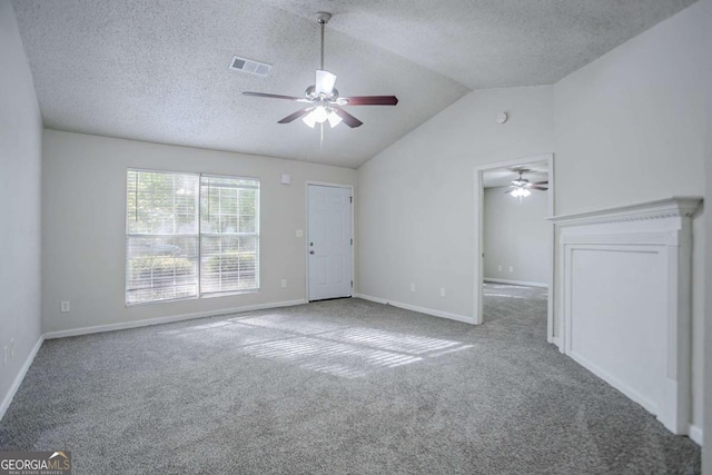 2800 Macon Dr SE, Atlanta, GA 30354 - unfurnished living room featuring ceiling fan, carpet, vaulted ceiling, a textured ceiling, and baseboards