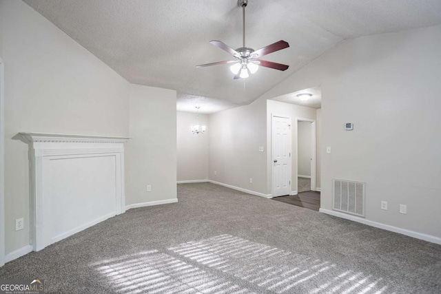 2800 Macon Dr SE, Atlanta, GA 30354 - unfurnished living room with a chandelier, ceiling fan, carpet flooring, vaulted ceiling, and baseboards