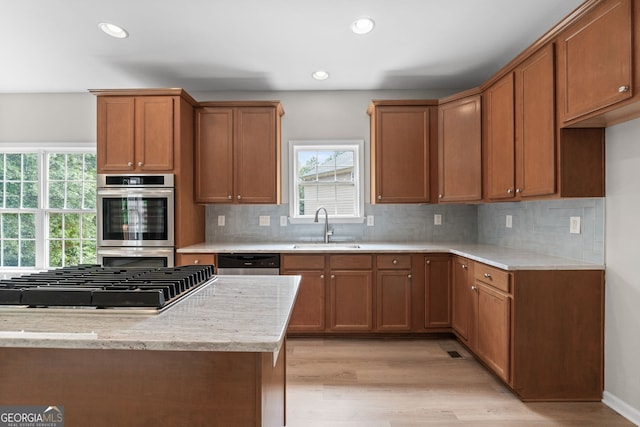 1429 Kentmire Ct, Locust Grove, GA 30248 - kitchen with a sink, appliances with stainless steel finishes, healthy amount of natural light, light wood-type flooring, and recessed lighting