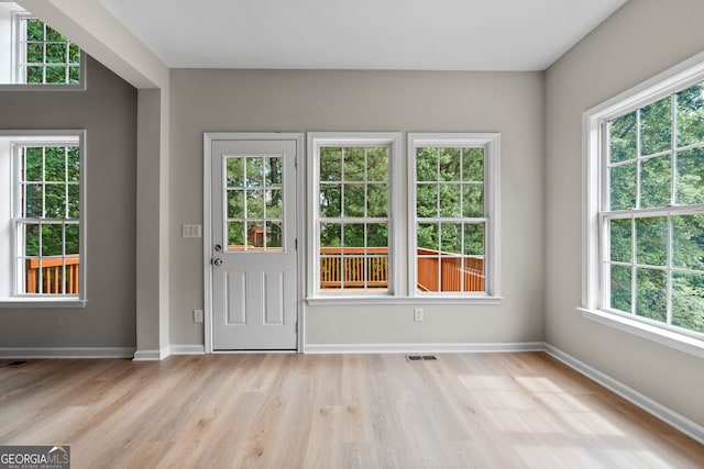 1429 Kentmire Ct, Locust Grove, GA 30248 - doorway to outside featuring light wood finished floors and baseboards