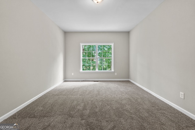 1429 Kentmire Ct, Locust Grove, GA 30248 - carpeted empty room featuring baseboards